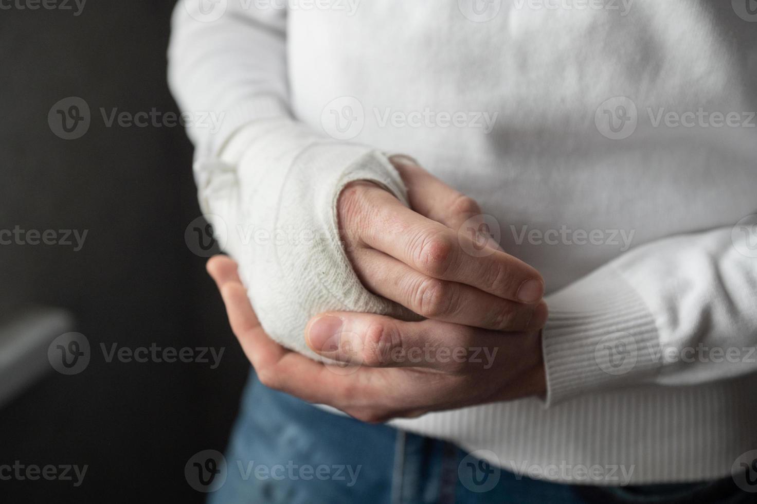 A man's broken arm in a cast photo