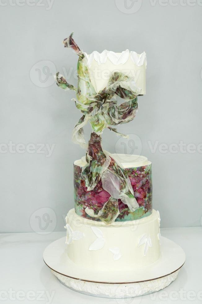 Large wedding cake with rice paper decorations photo