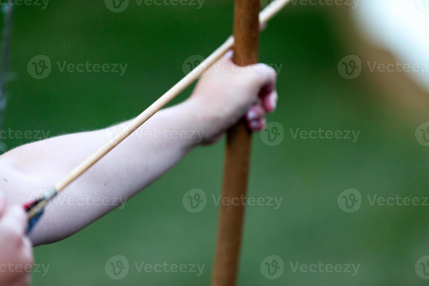 Archer ready to shoot an arrow photo