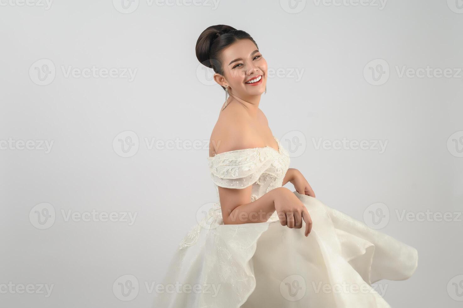 Young asian beautiful bride smile with happy on white background photo