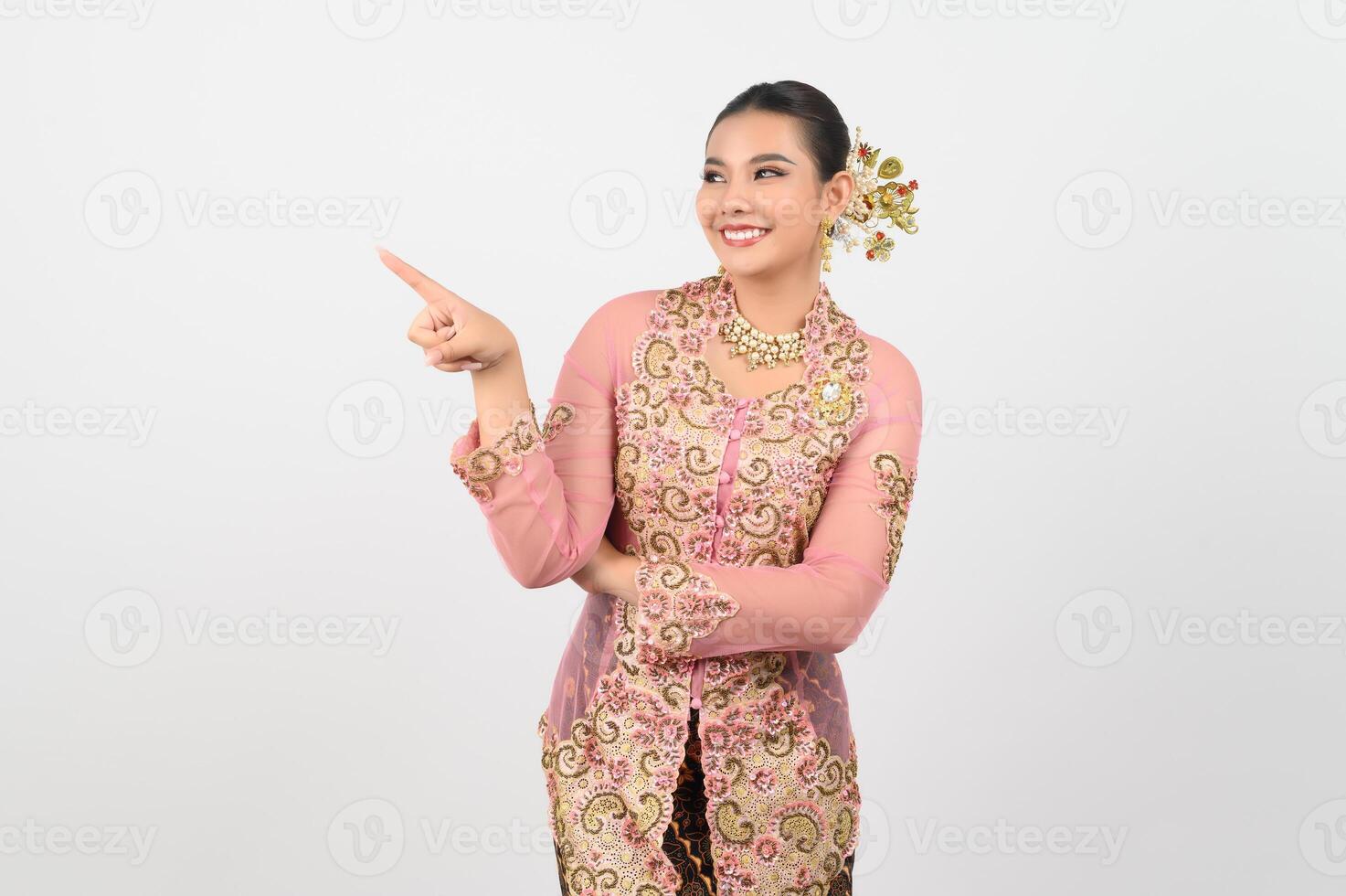 Young beautiful woman dres local culture in southern point finger posture photo