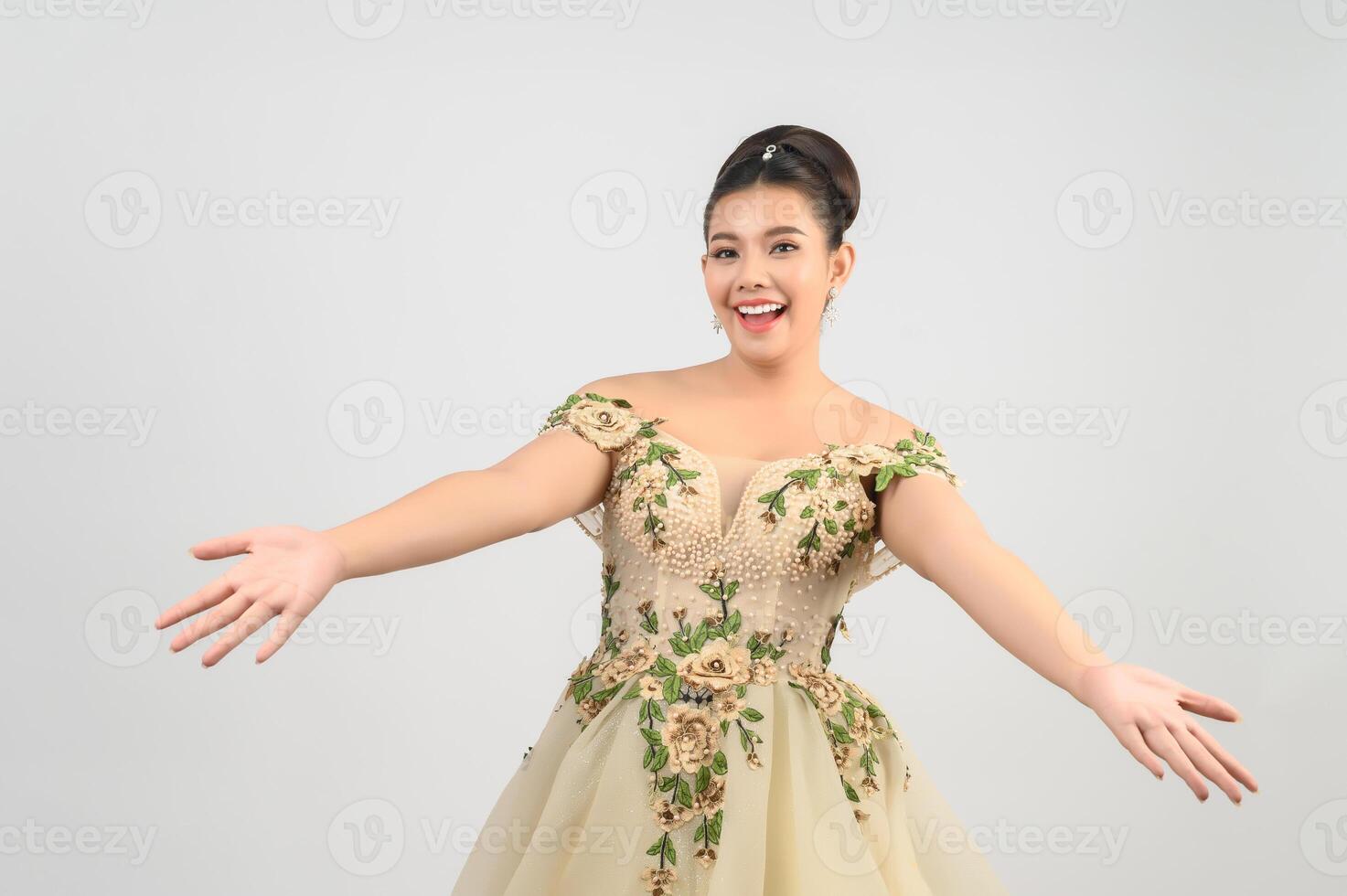 Young asian beautiful bride pose with open two palm on white background photo