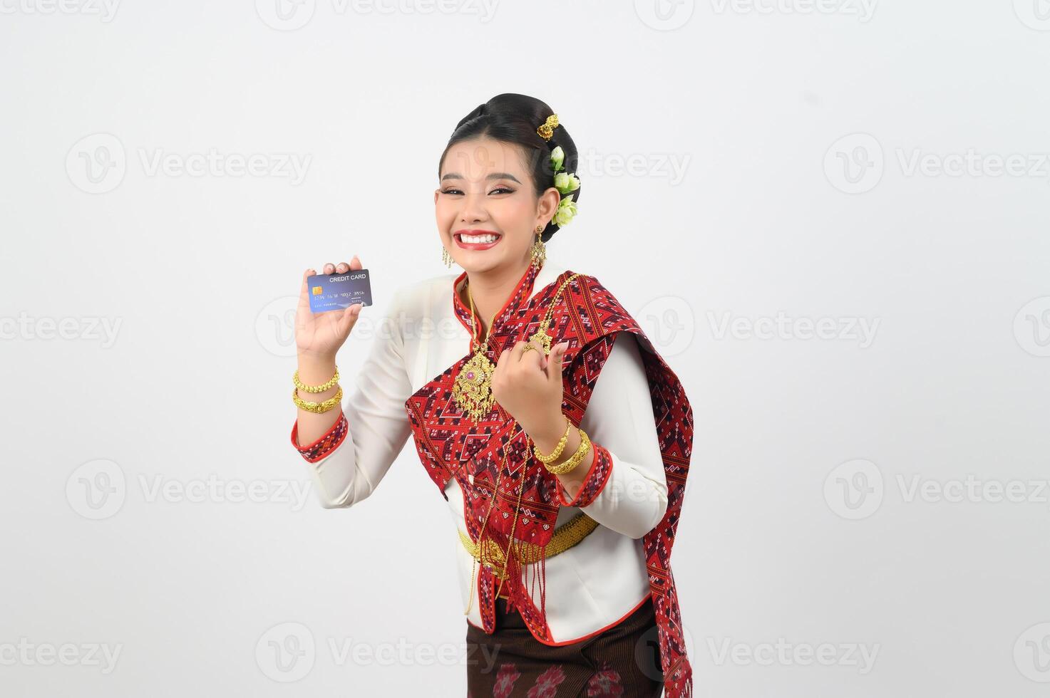 Young beautiful woman in northeastern dress show credit card posture photo
