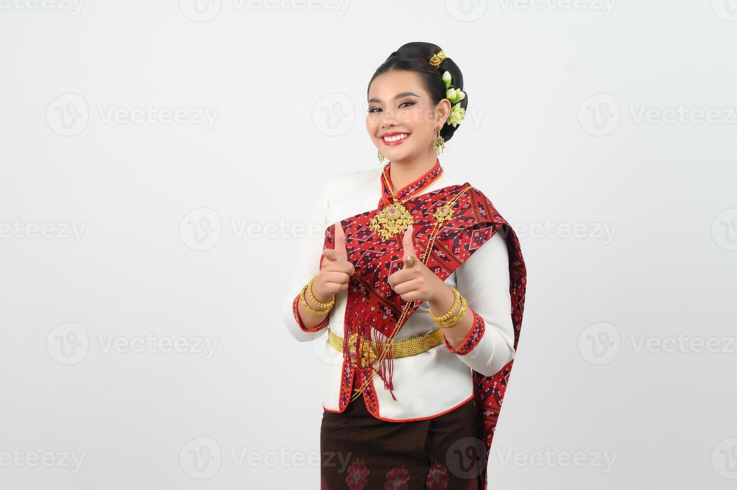 Young beautiful woman in northeastern dress stand and point finger posture photo