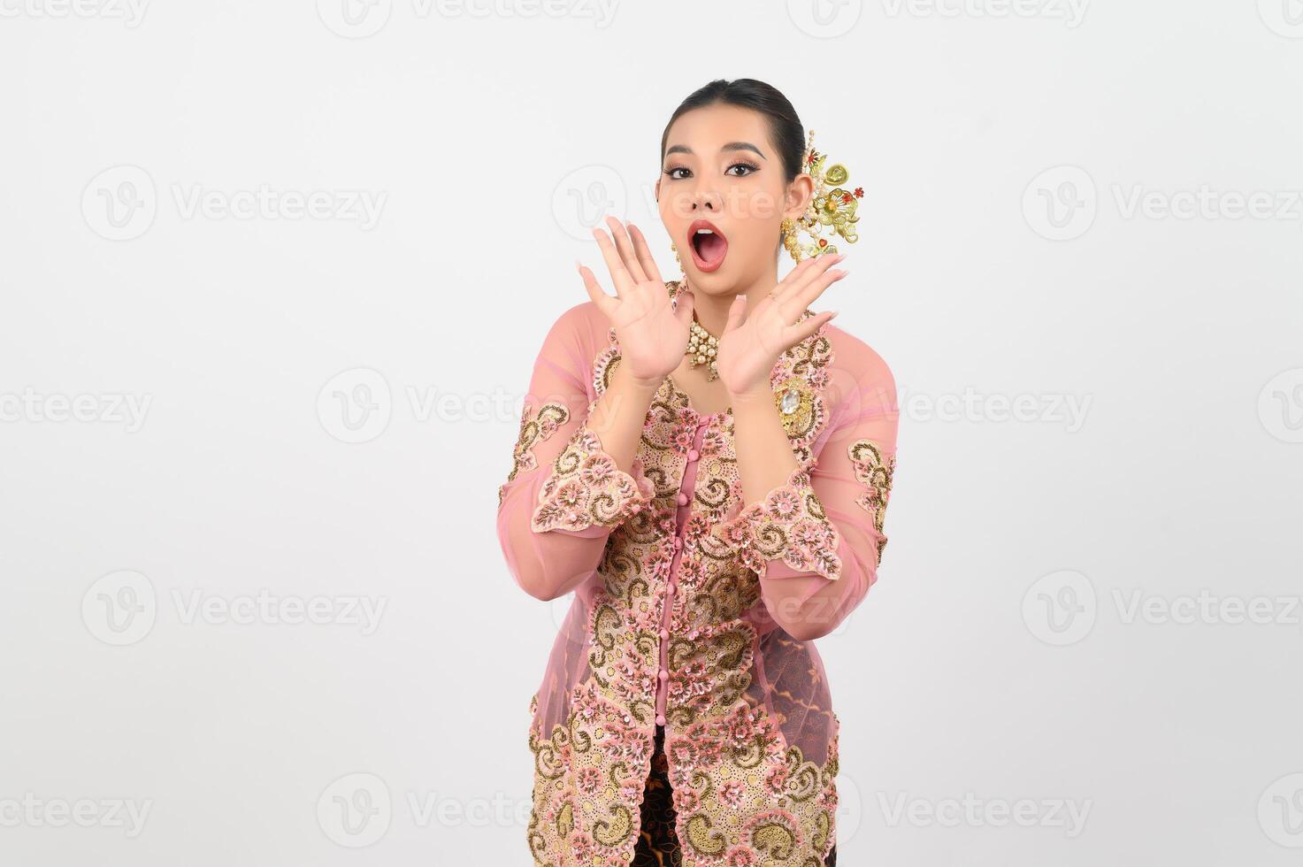 Young beautiful woman dress up in local culture in southern region with shouting posture photo