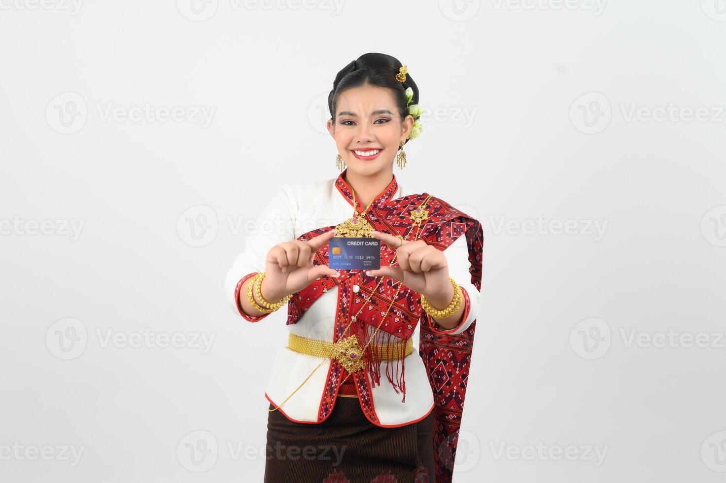 Young beautiful woman in northeastern dress show credit card posture photo