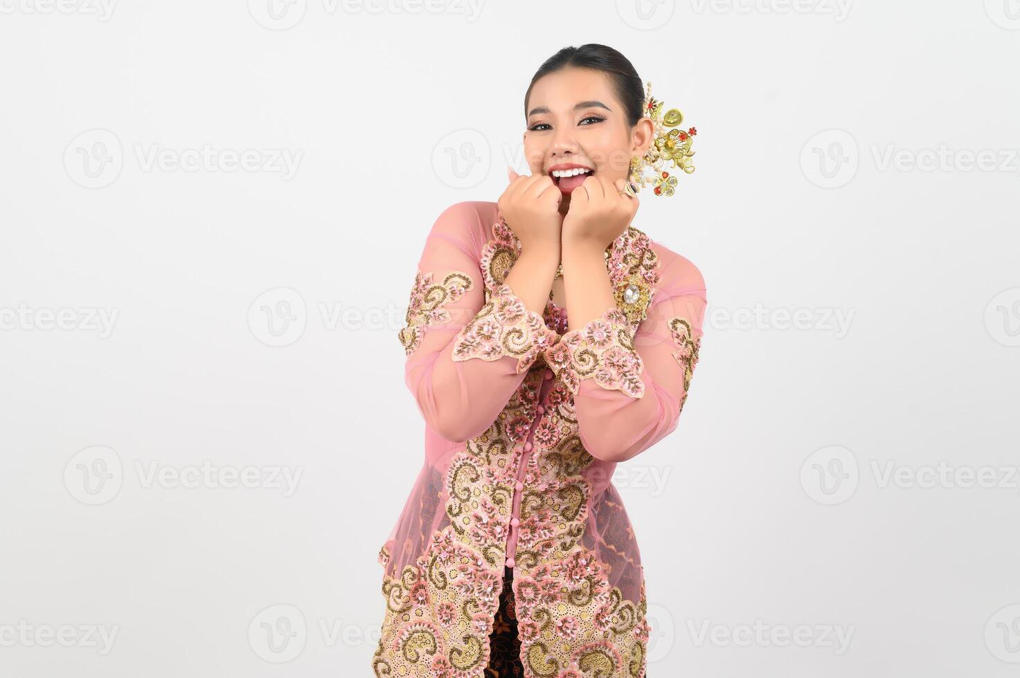 Young beautiful woman dress up in local culture in southern region with cheerful posture photo