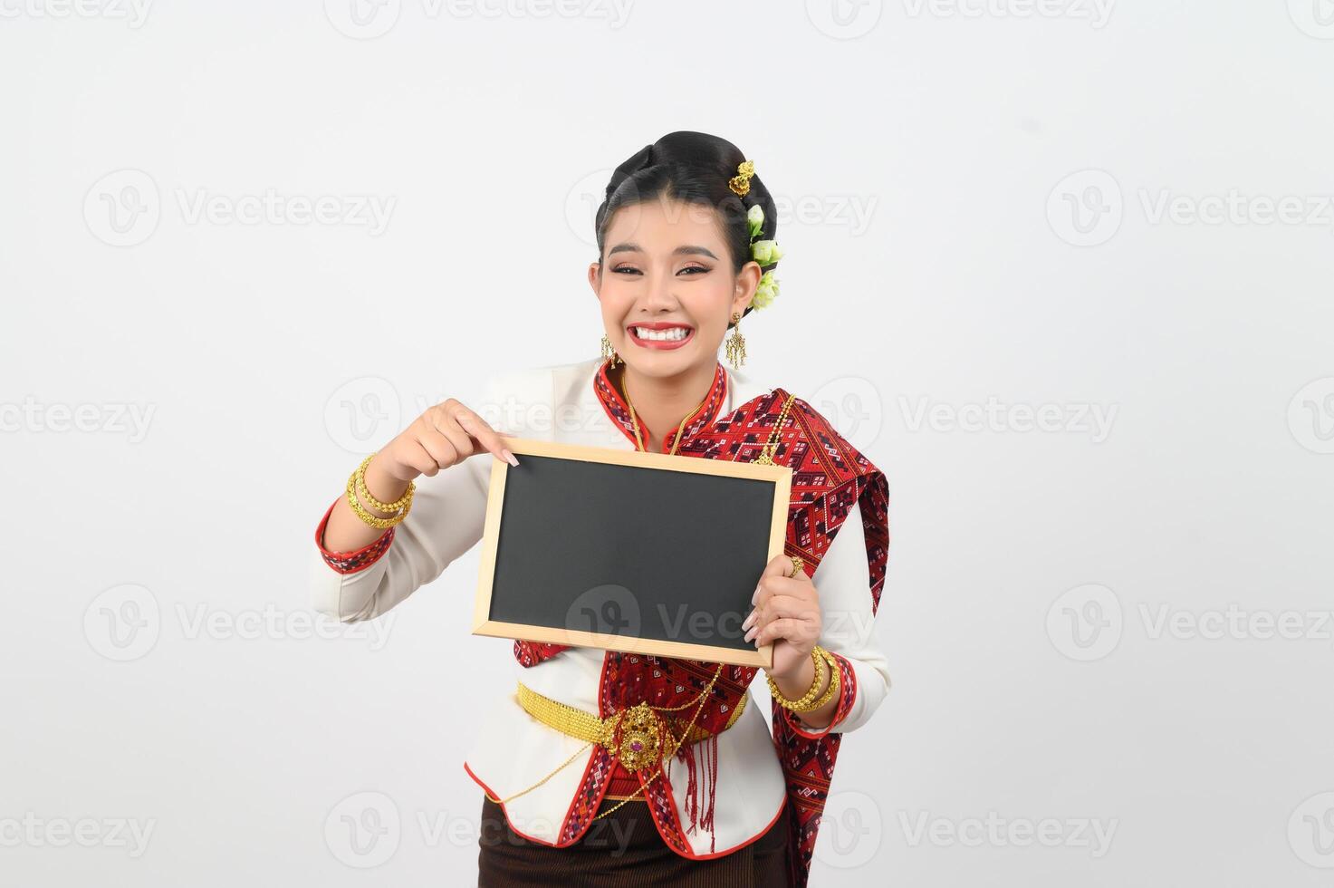 Portrait of Beautiful Thai Woman in Traditional Clothing Posing with blackboard photo