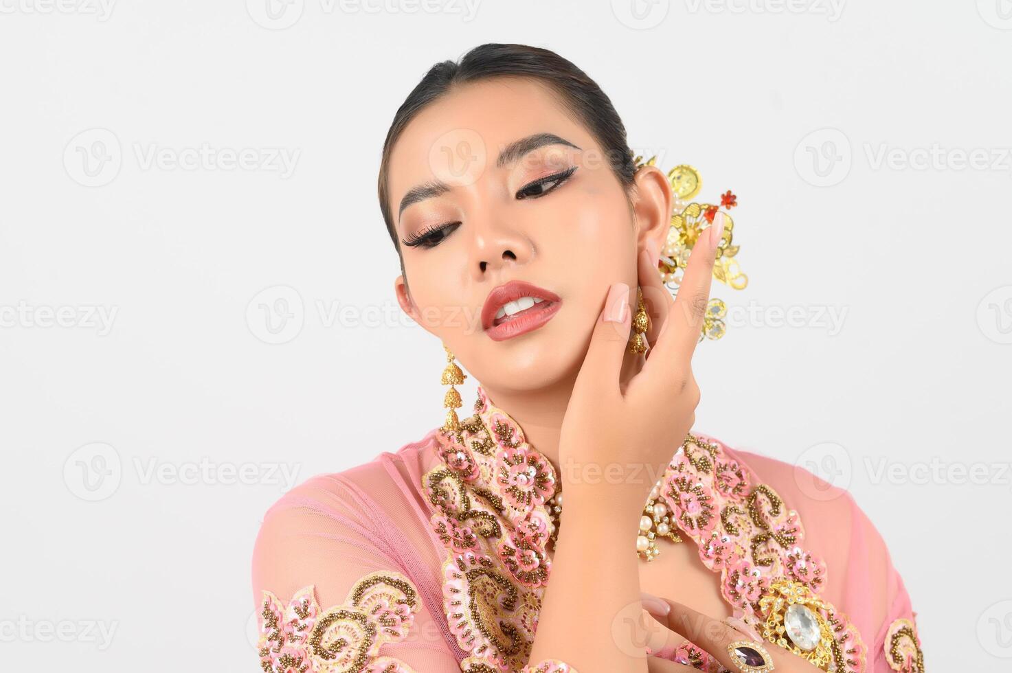 Young beautiful woman dress up in local culture in southern region with beauty posture photo