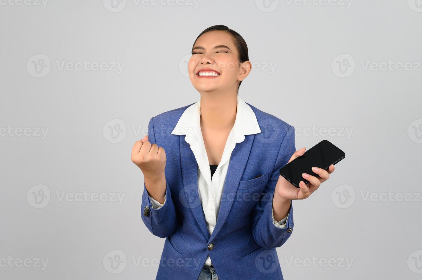 Young beautiful woman in formal clothing for officer use smartphone posture photo