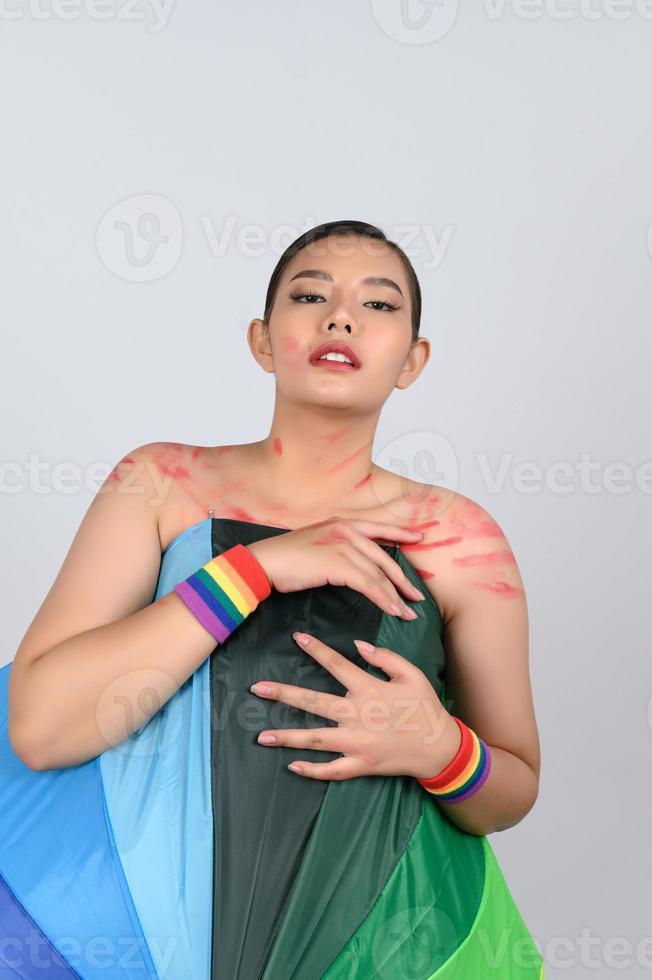 Pretty woman LGBQ pose with colorful umbrella photo