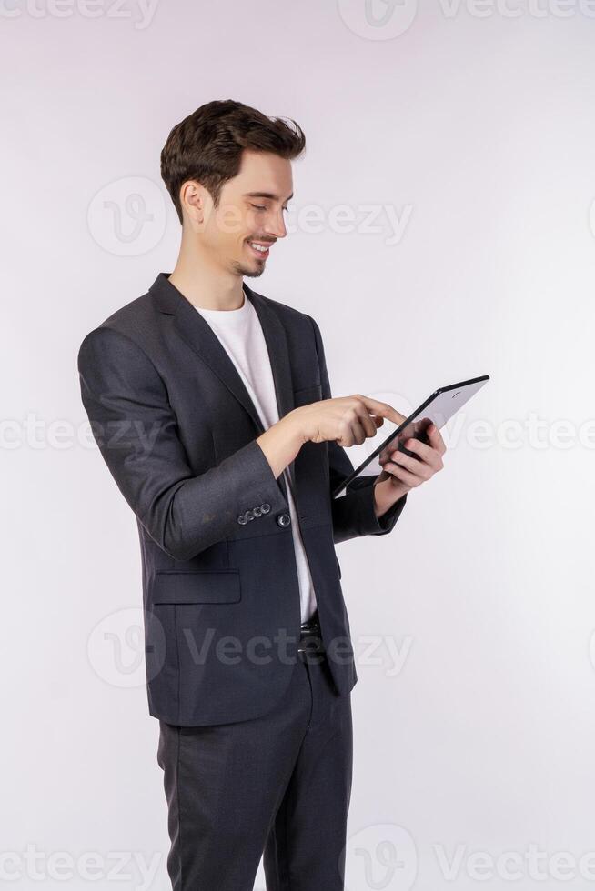 Portrait of attractive cheerful businessman using device app searching web isolated over white color background photo