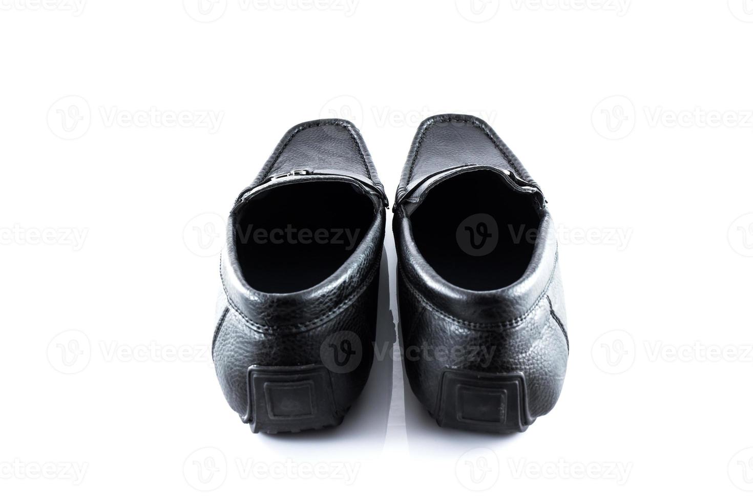 Pair of black male classic shoes on white background photo