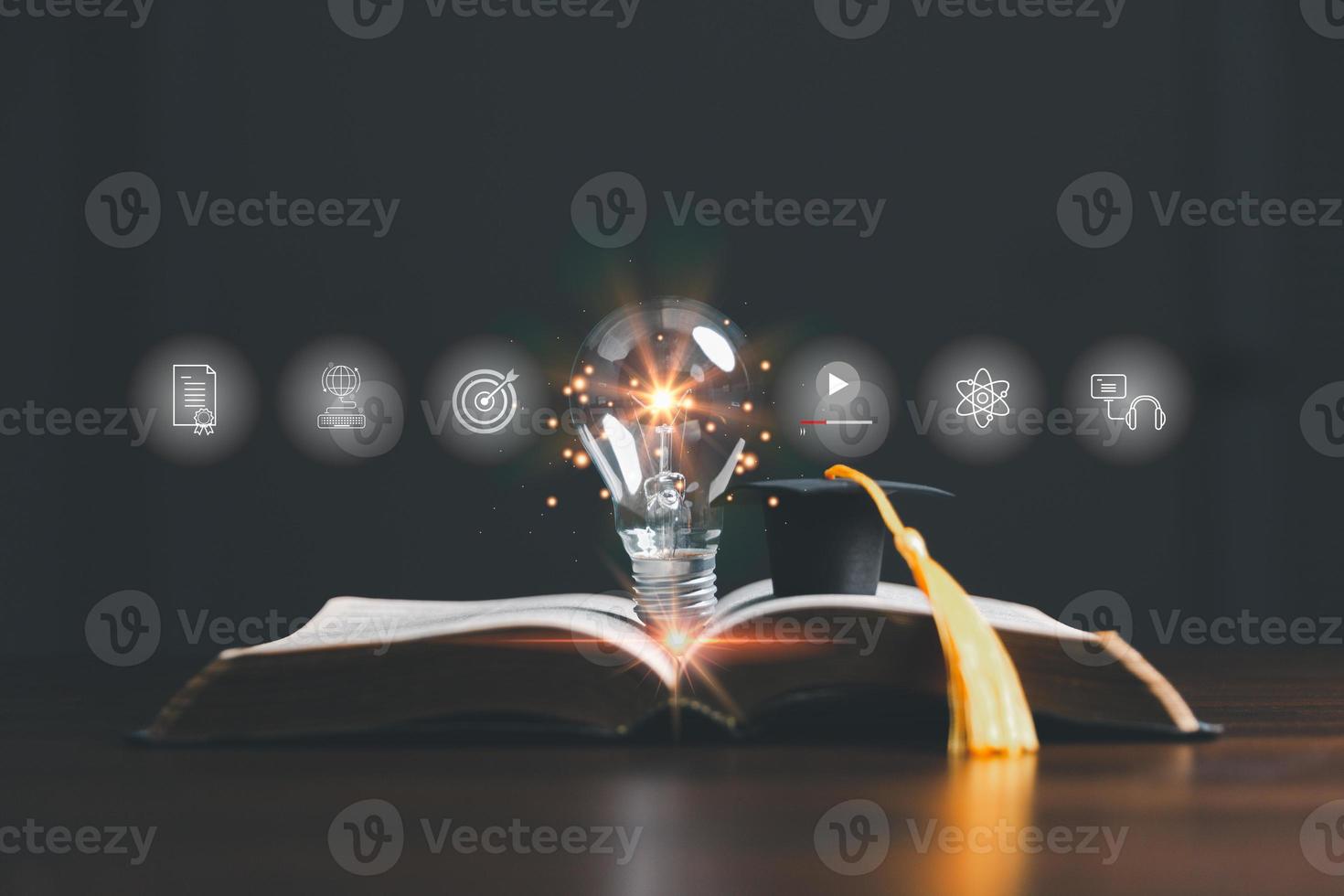 Lightbulb on book with education e-learning icons, Internet education course degree, study knowledge to creative thinking idea and solving solution. E-learning graduate certificate program concept. photo