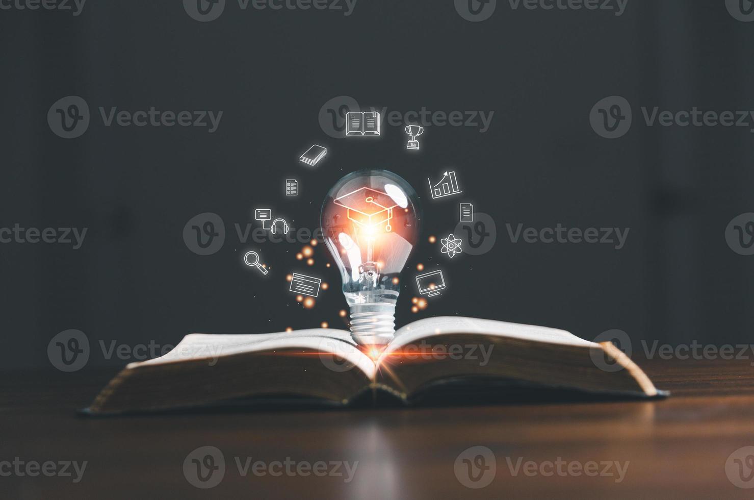 Lightbulb on book with education e-learning icons, Internet education course degree, study knowledge to creative thinking idea and solving solution. E-learning graduate certificate program concept. photo