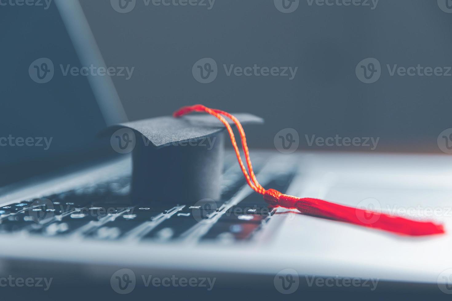 Graduation cap on laptop computer. Concept of global business study, abroad educational, Back to School. Education in Global world, Study abroad business in universities in worldwide. language study photo