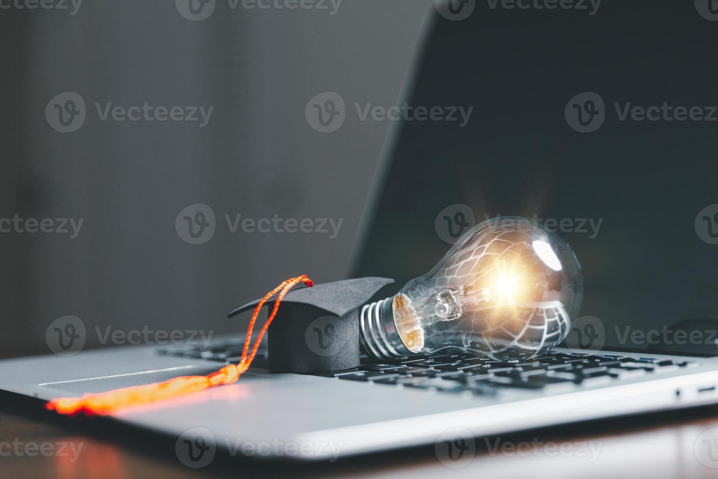 Light bulbs and books with graduation hat. Concept of reading books, knowledge, and searching for new ideas. Innovation and inspiration, Creativity with twinkling lights, the inspiration of ideas. photo