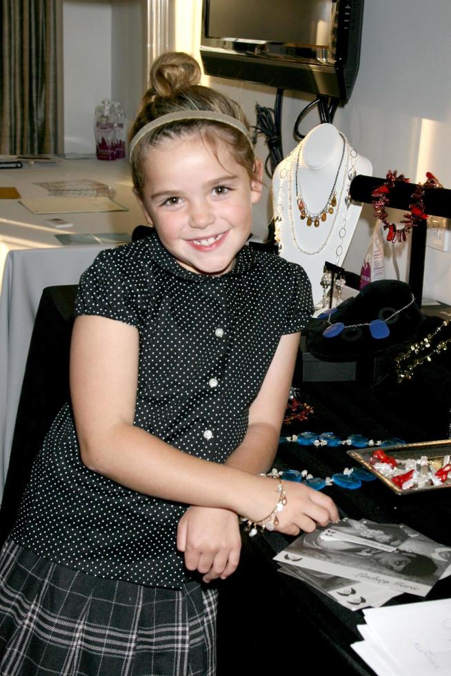 Kiernan Shipka of Mad Menmodeling her new bracelet by Lindsay Marie PearlsGBK Gifting SuiteThompson HotelBeverly Hills CAJanuary 11 20082008 photo