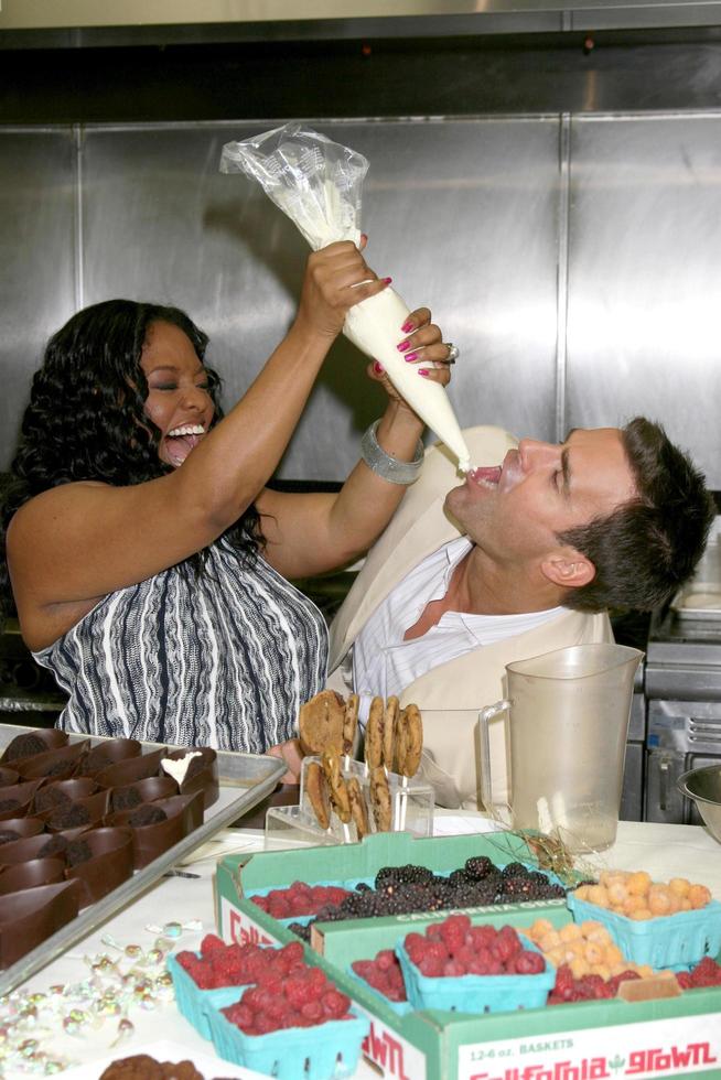 Sherri Shepherd and Cameron Mathison in the Wolfgang Puck Catering kitchen demonstrating and trying the deserts for the Daytime Emmy dinner adjacent to the Kodak Theater piror to Daytime Emmys at the Kodak Theater in Hollywood, CA June 19, 2008 photo