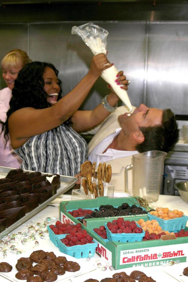 Sherri Shepherd and Cameron Mathison in the Wolfgang Puck Catering kitchen demonstrating and trying the deserts for the Daytime Emmy dinner adjacent to the Kodak Theater piror to Daytime Emmys at the Kodak Theater in Hollywood, CA June 19, 2008 photo