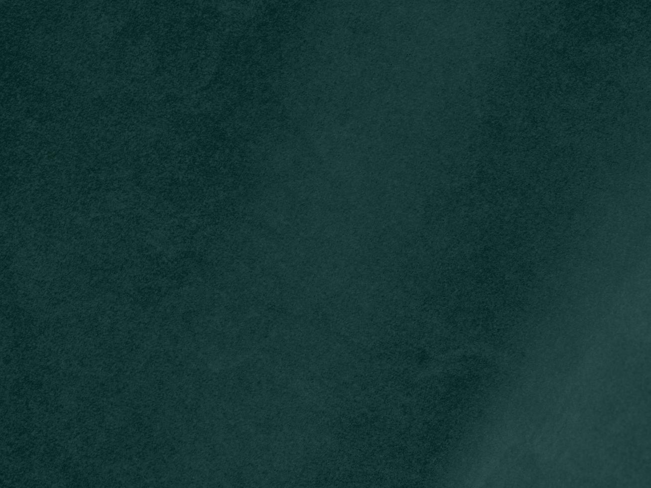Dark green velvet fabric texture used as background. Empty green fabric background of soft and smooth textile material. There is space for text. photo