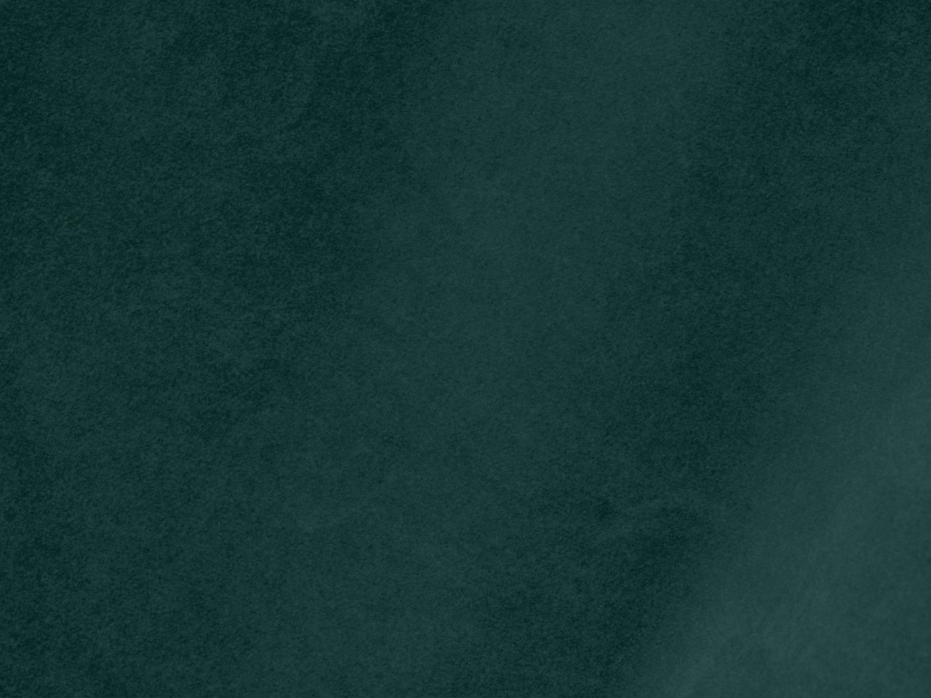 Dark green velvet fabric texture used as background. Empty green fabric background of soft and smooth textile material. There is space for text. photo