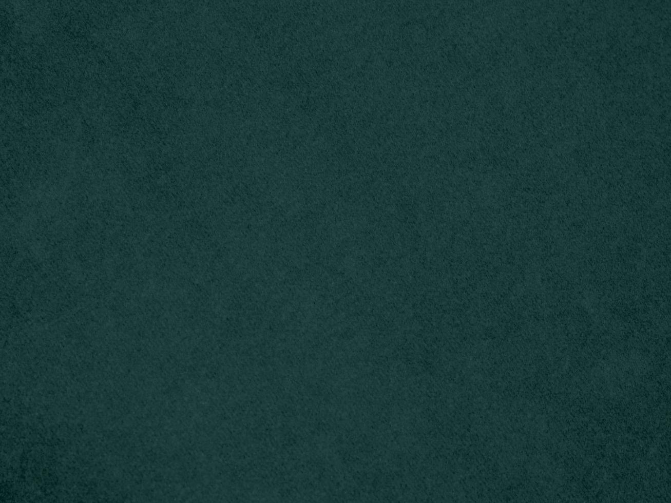 Dark green velvet fabric texture used as background. Empty green fabric background of soft and smooth textile material. There is space for text. photo