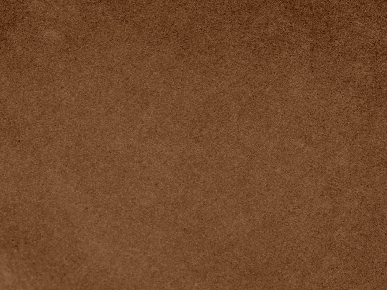 Brown color velvet fabric texture used as background. Empty brown fabric background of soft and smooth textile material. There is space for text. photo