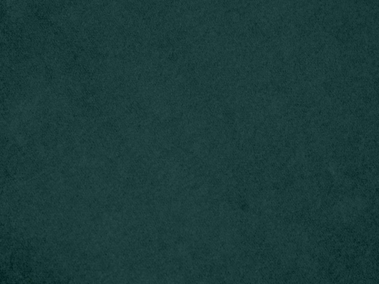 Dark green velvet fabric texture used as background. Empty green fabric background of soft and smooth textile material. There is space for text. photo