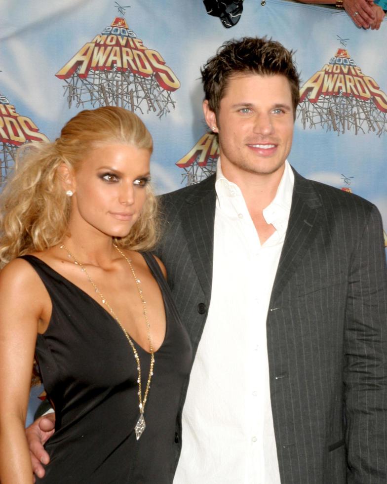 Jessica Simpson and Nick Lacheyarriving  at the MTV Movie Awards at the Shrine Auditorium Los Angeles CAJune 4 20052005 photo
