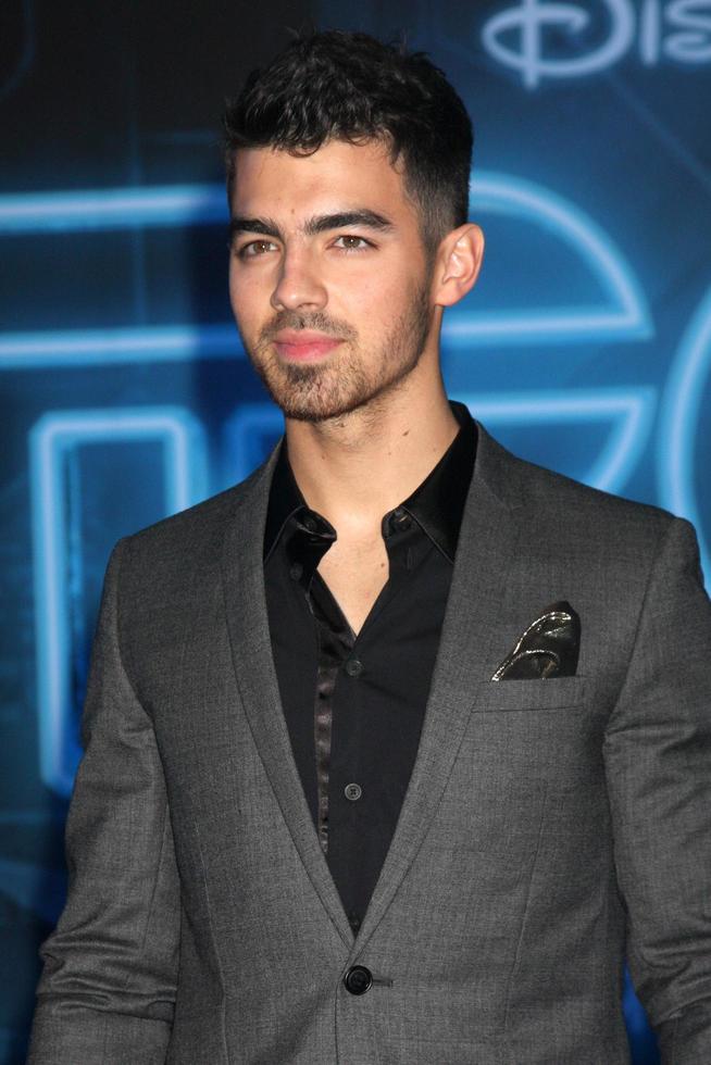 LOS ANGELES  DEC 11  Joe Jonas arrives at the TRON Legacy Premiere at El Capitan Theater on December 11 2010 in Los Angeles CA photo