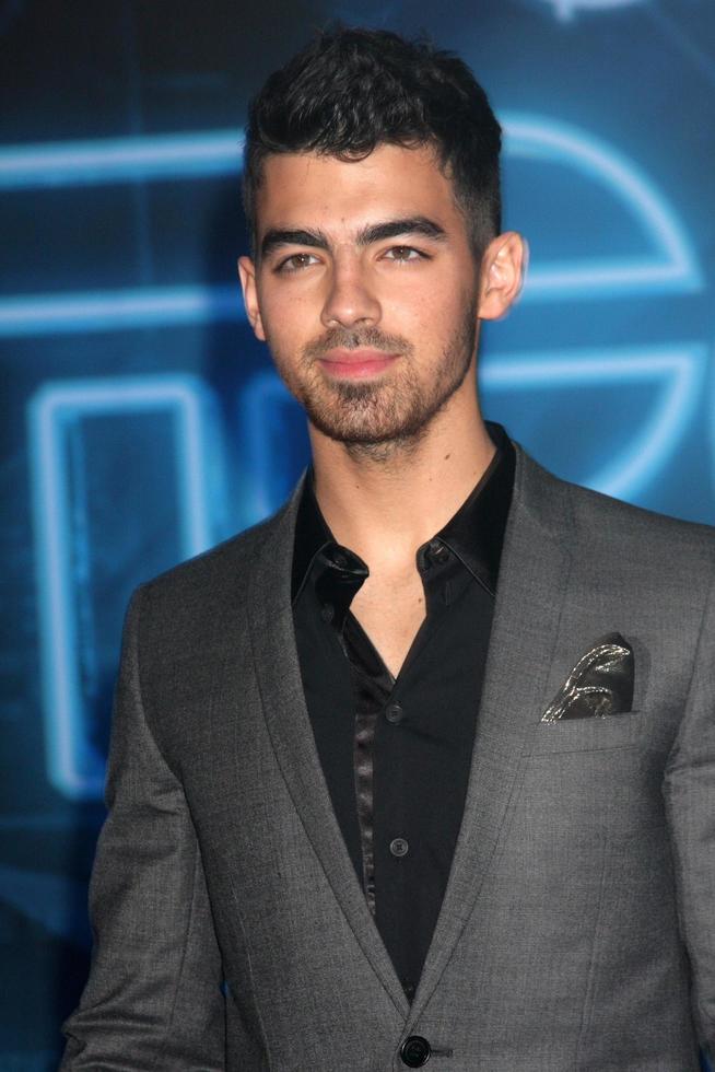 LOS ANGELES  DEC 11  Joe Jonas arrives at the TRON Legacy Premiere at El Capitan Theater on December 11 2010 in Los Angeles CA photo