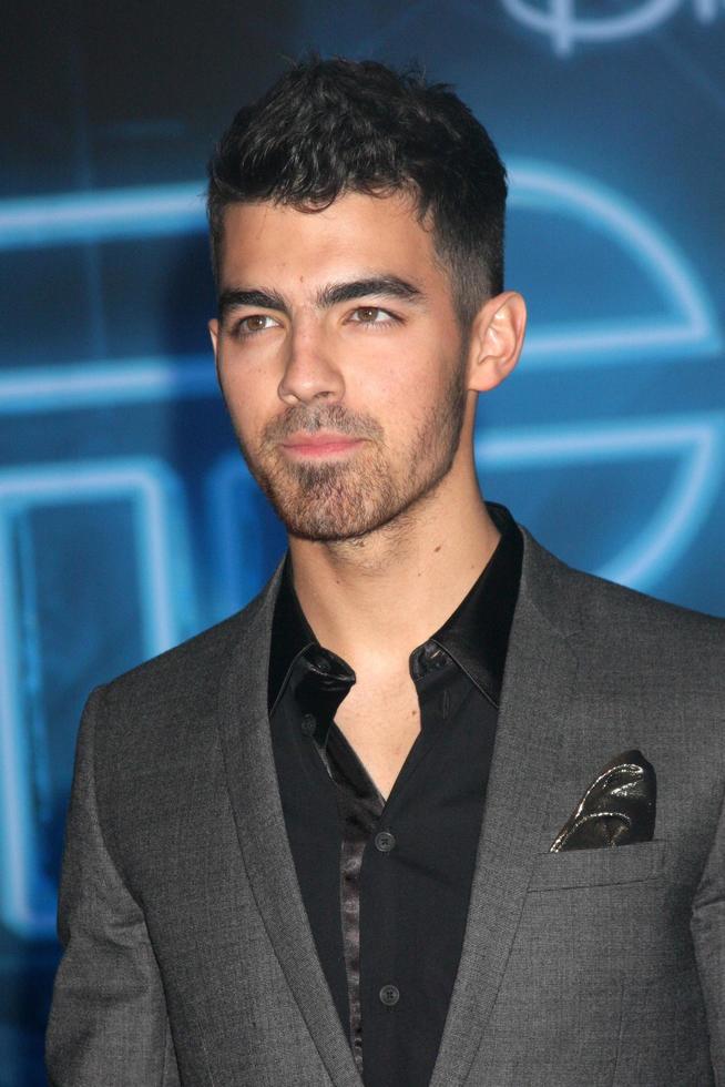 LOS ANGELES  DEC 11  Joe Jonas arrives at the TRON Legacy Premiere at El Capitan Theater on December 11 2010 in Los Angeles CA photo