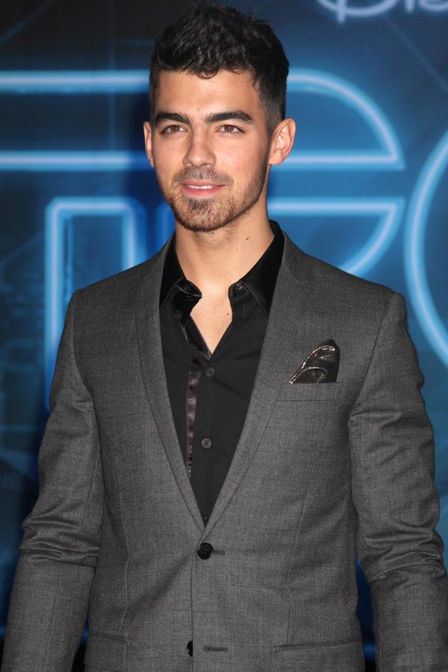 LOS ANGELES  DEC 11  Joe Jonas arrives at the TRON Legacy Premiere at El Capitan Theater on December 11 2010 in Los Angeles CA photo