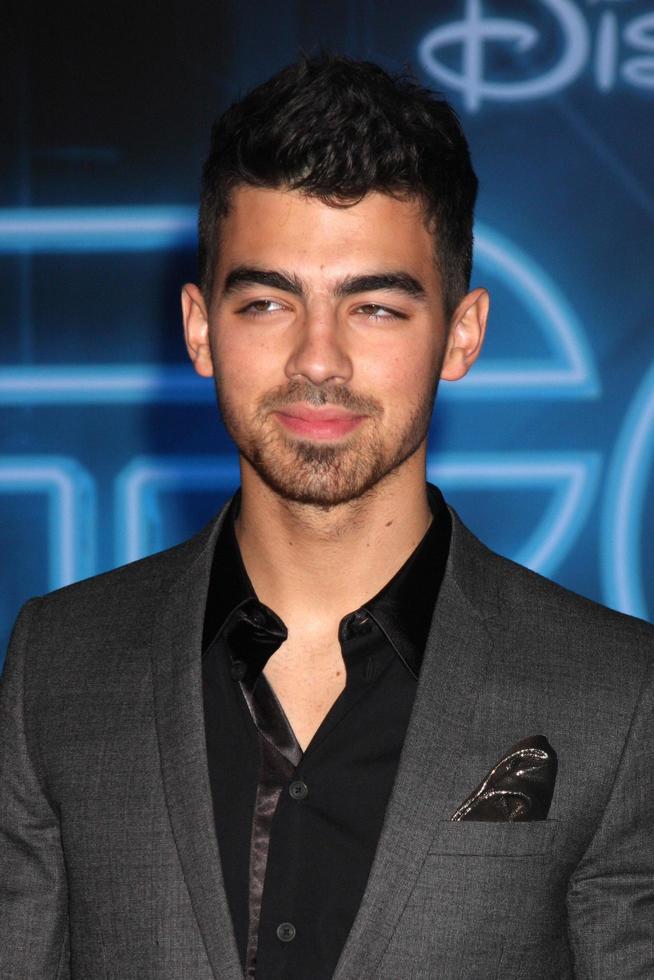LOS ANGELES  DEC 11  Joe Jonas arrives at the TRON Legacy Premiere at El Capitan Theater on December 11 2010 in Los Angeles CA photo