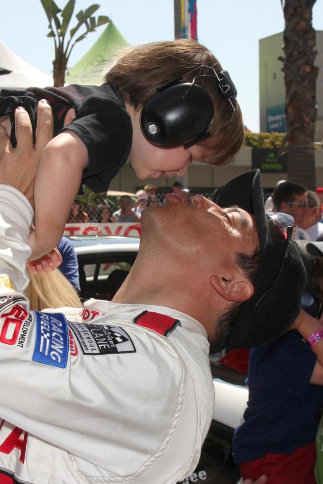 Carlos Mencia  Son Lucas Pablo Mencia  at the  Toyota ProCeleb Race Day on April 18 2009 at the Long Beach Grand Prix course in Long Beach California2009 photo