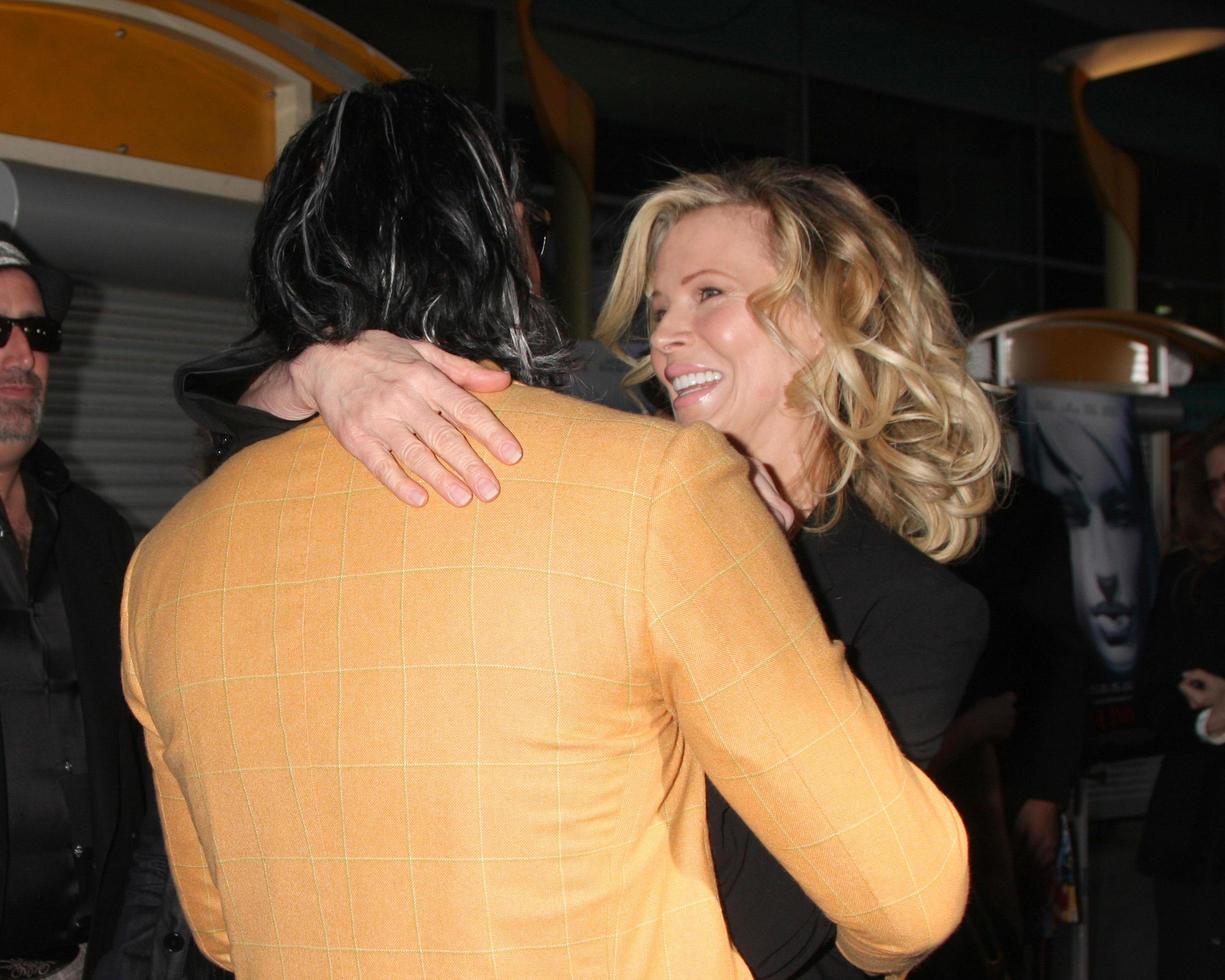 Mickey Rourke  Kim Basinger  arriving at the Informers LA Premiere  at the ArcLight Theaters  in Los Angeles CA on April 16 20092009 photo