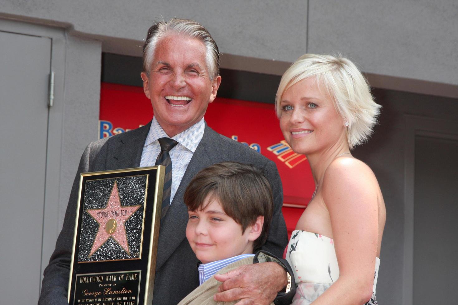 George Hamilton  son GT with girlfriend Barbara Strum at the Hollywood Walk of Fame ceremony bestowing a Star in his honor  in Hollywood CA  on August 12  2009 2009 photo