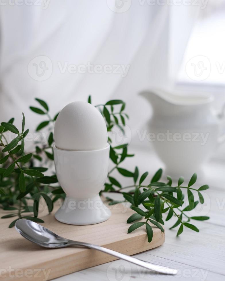 Freshly boiled white egg on a wooden board. Healthy breakfast. Morning concept photo