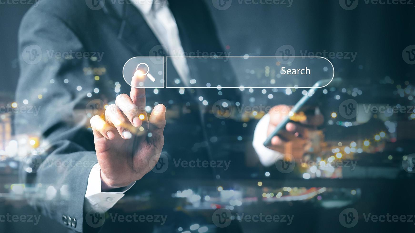 Businessman use smart phone Search On Virtual Screen Data Search Technology Search Engine Optimization. Searching for information. Using Search Console for data, info. photo
