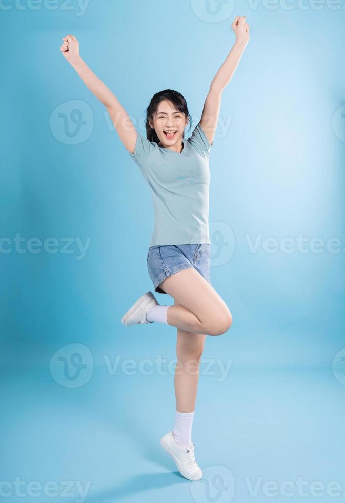 Asian woman on blue background photo