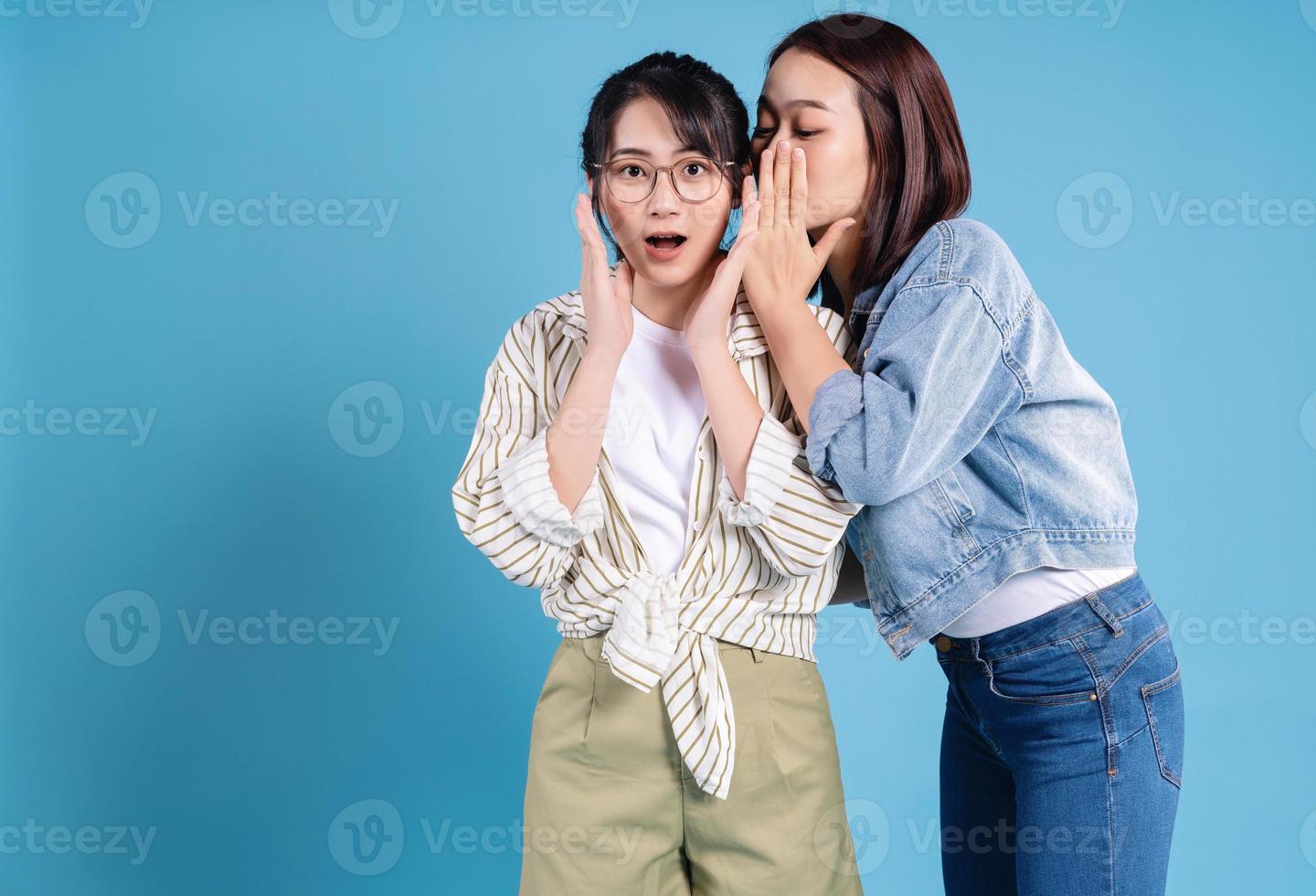 Two women on blue background photo