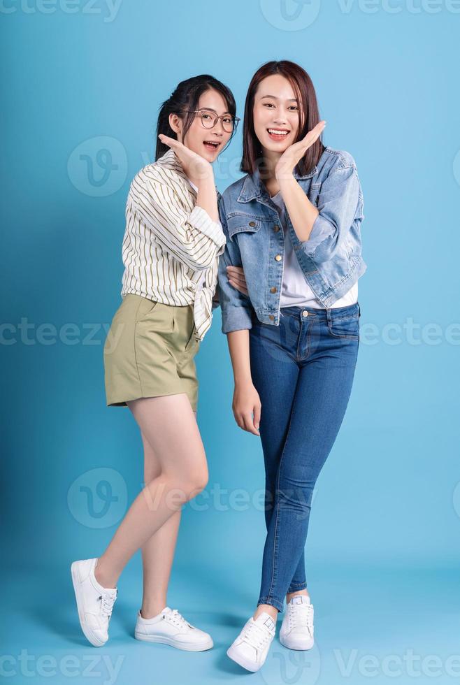 Two women on blue background photo