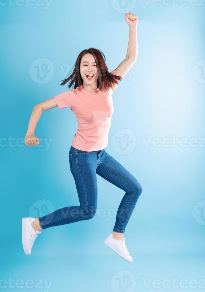 Asian woman on blue background photo