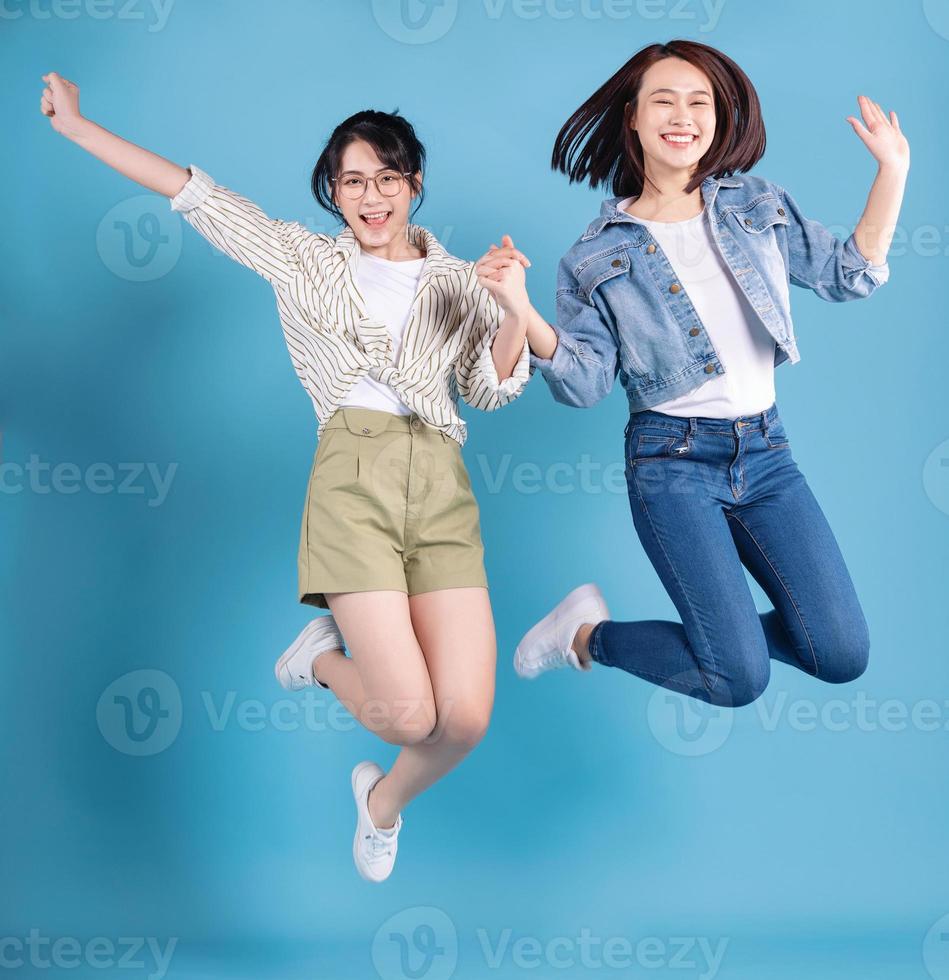 Two women on blue background photo