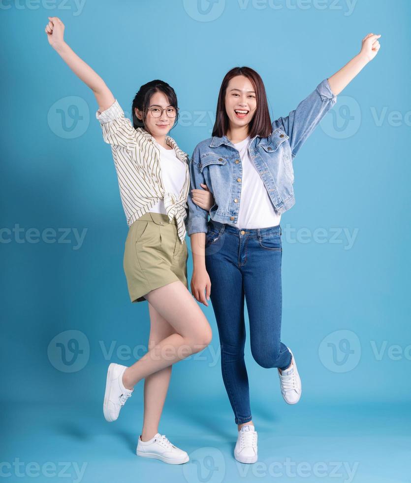 Two women on blue background photo
