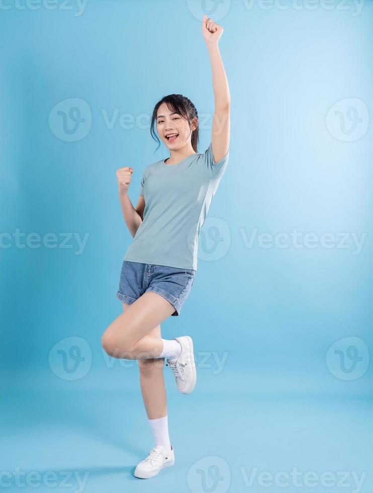 Asian woman on blue background photo