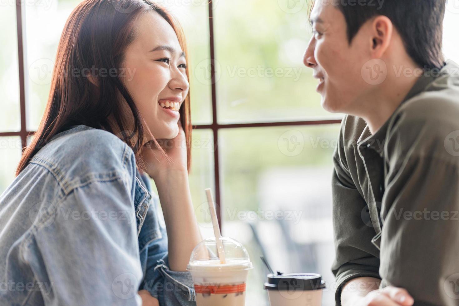 Young Asian couple dating at coffee shop photo