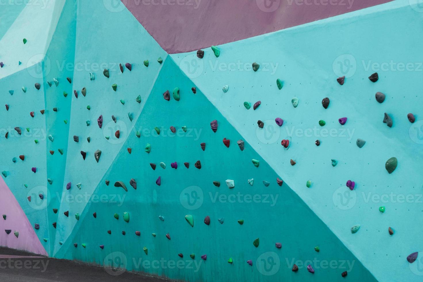 colorful rock climbing wall on the street photo
