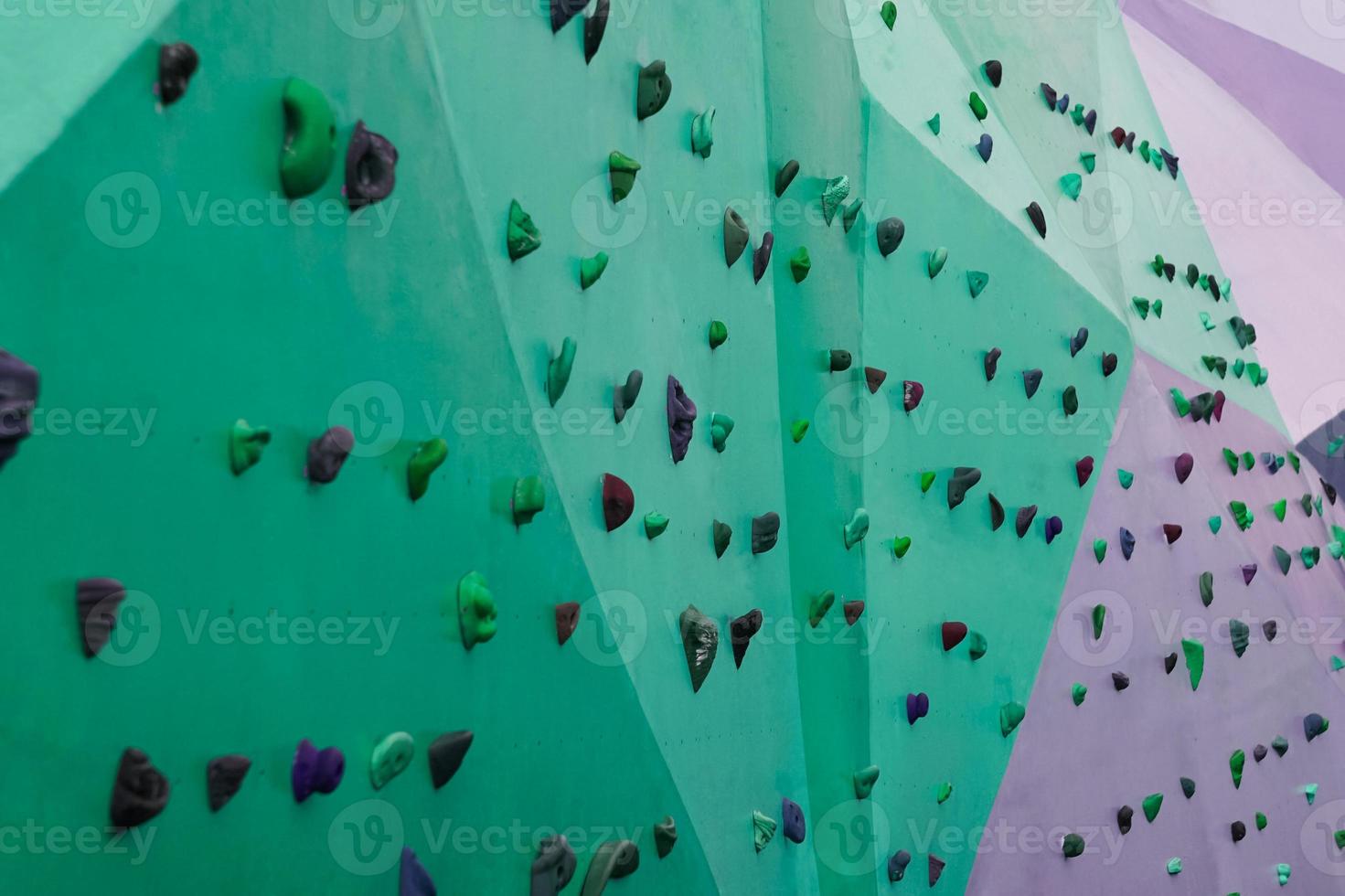 colorful rock climbing wall on the street photo